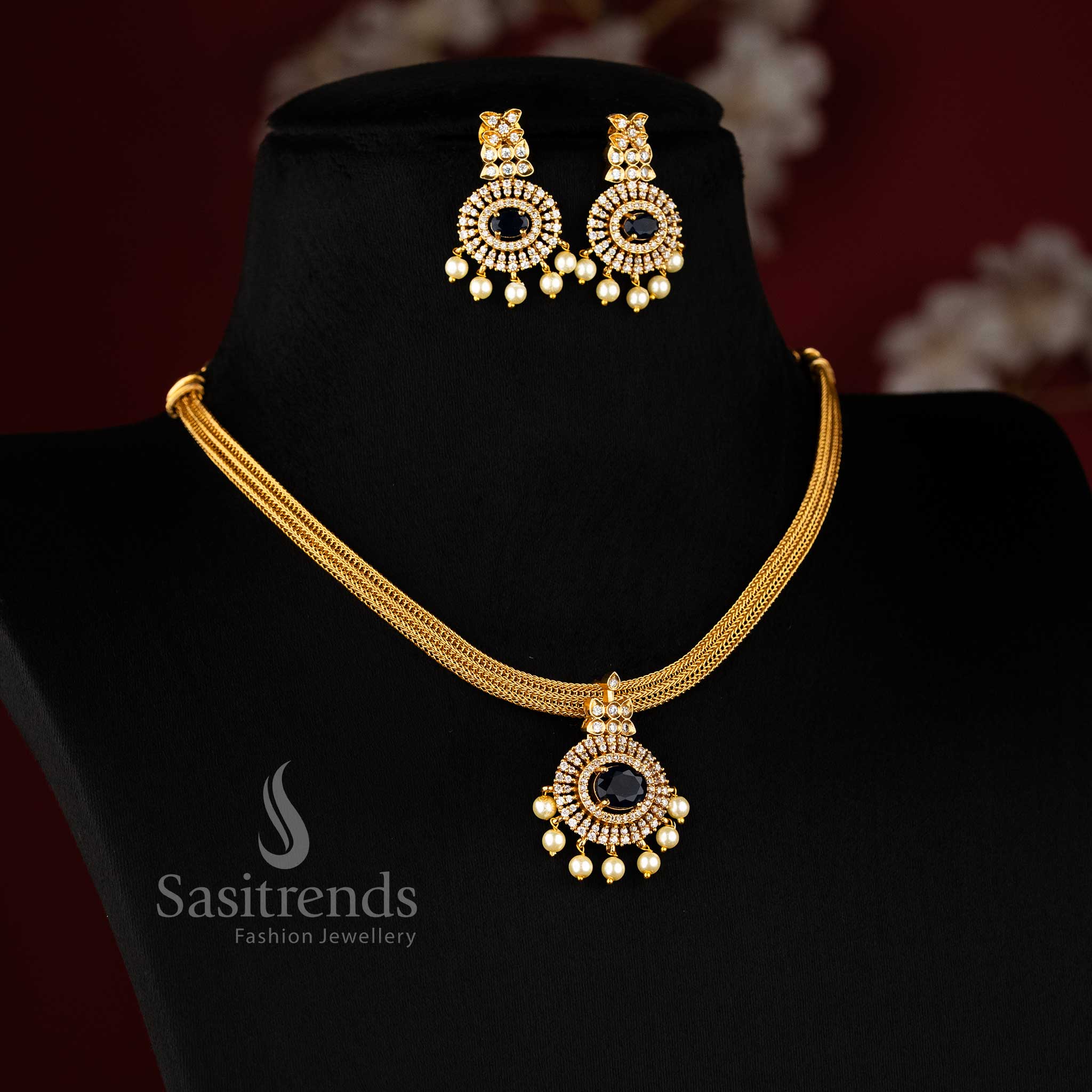 Elegant blue Attigai choker with temple-style floral pendant and matte gold finish – ideal for festive saree looks – Sasitrends