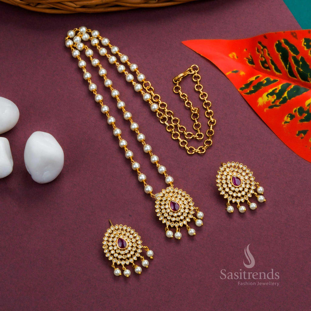 Graceful Temple White Ruby Pearl Jewellery Set With Matte Gold Floral Pendant And Droplet Pearl Hangings – A Divine Design With Sparkling AD Stones, Ruby Highlights, And Traditional Craftsmanship – Sasitrends