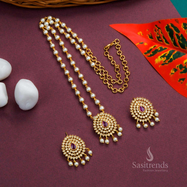 Graceful Temple White Ruby Pearl Jewellery Set With Matte Gold Floral Pendant And Droplet Pearl Hangings – A Divine Design With Sparkling AD Stones, Ruby Highlights, And Traditional Craftsmanship – Sasitrends