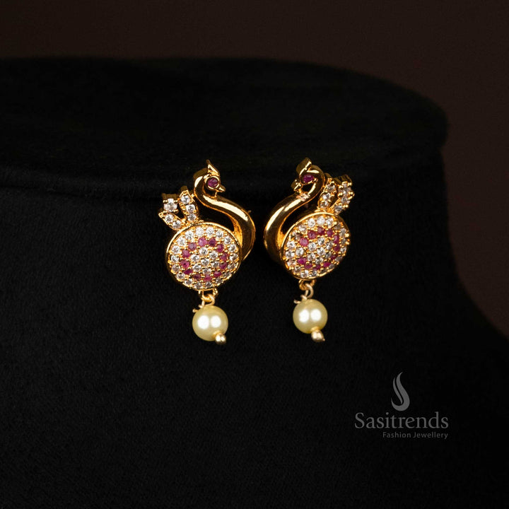 Zoomed-in shot of earrings featuring peacock design and pearl drops - Sasitrends