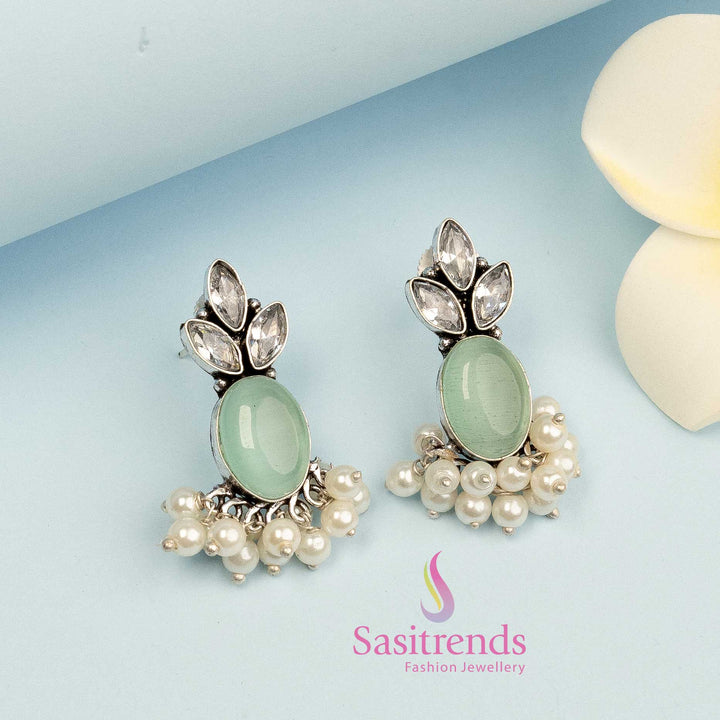 Mint-tinted oxidised earrings with glossy Monalisa gem and compact build – suited for polished formal jewellery wear – Sasitrends
