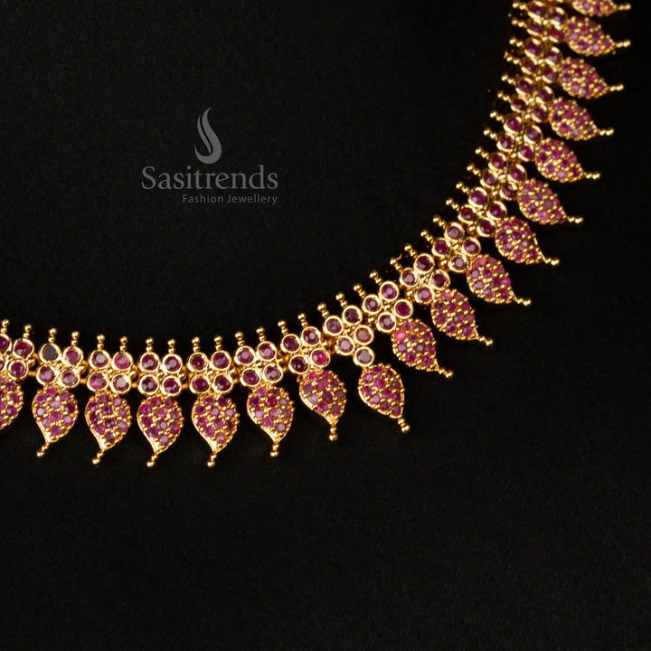 Grand micro gold plated leaf motif necklace jewellery set, embellished with deep ruby stones and shimmering American diamonds, perfect for weddings and cultural events - Sasitrends
