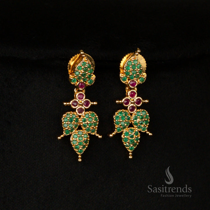 Ornate micro gold finish earrings set, designed with intricate leaf motifs and embellished with ruby-green stones and shimmering American diamonds, perfect for traditional celebrations - Sasitrends