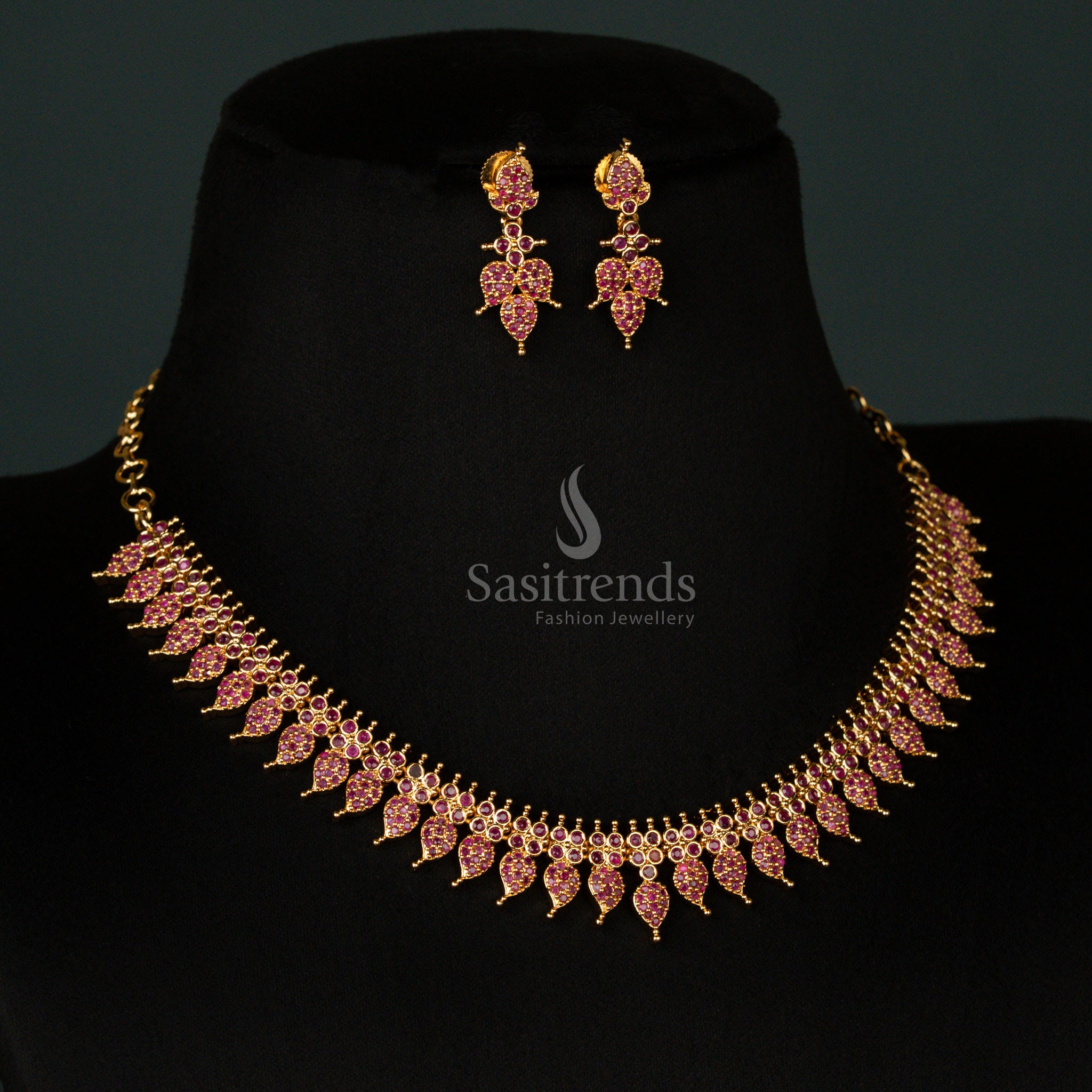 Classic micro gold plated leaf pattern necklace jewellery set with dazzling ruby stones and American diamonds, reflecting timeless elegance and festive grandeur - Sasitrends