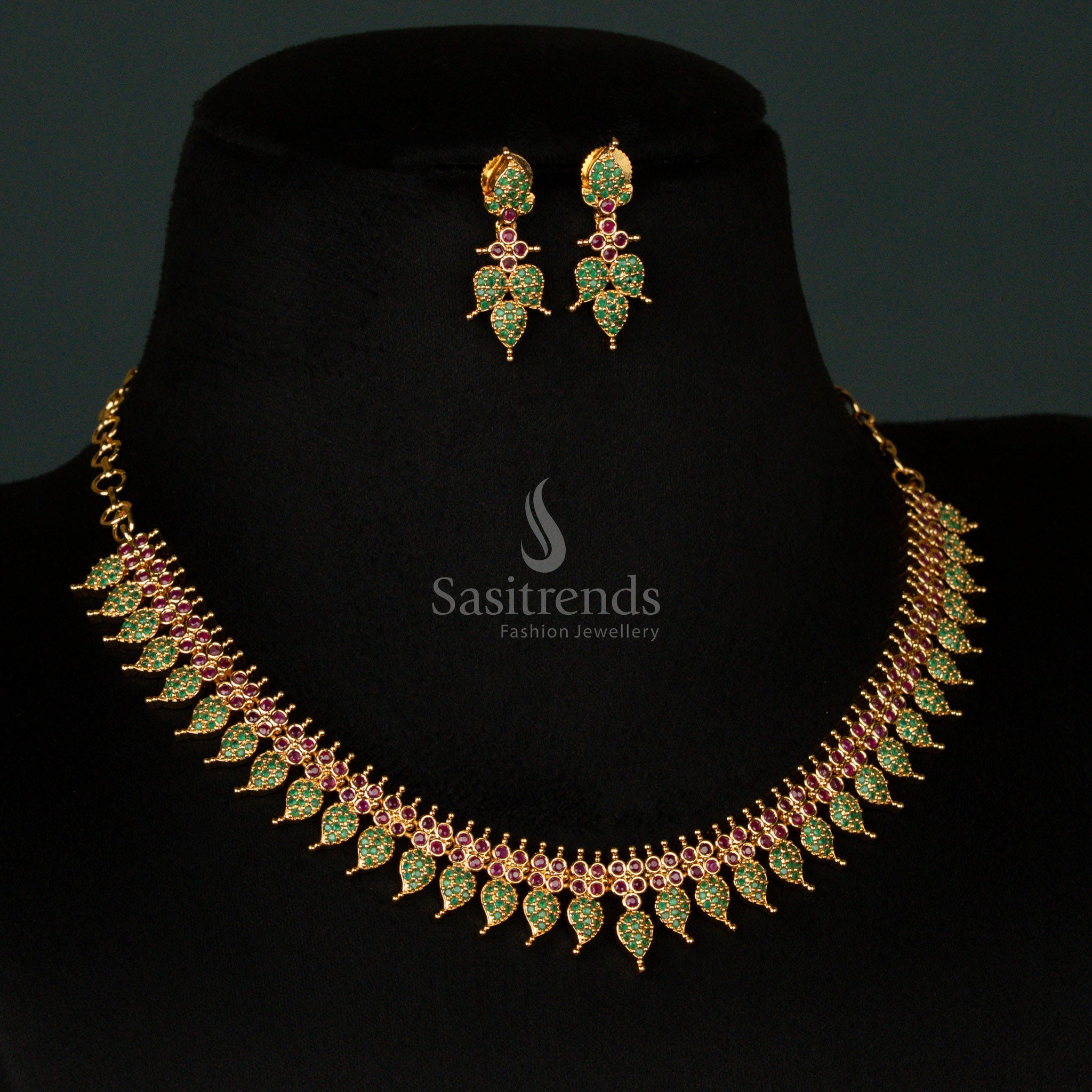Classic micro gold plated leaf pattern necklace jewellery set, featuring a stunning combination of ruby and green stones with sparkling American diamonds for a majestic festive charm - Sasitrends