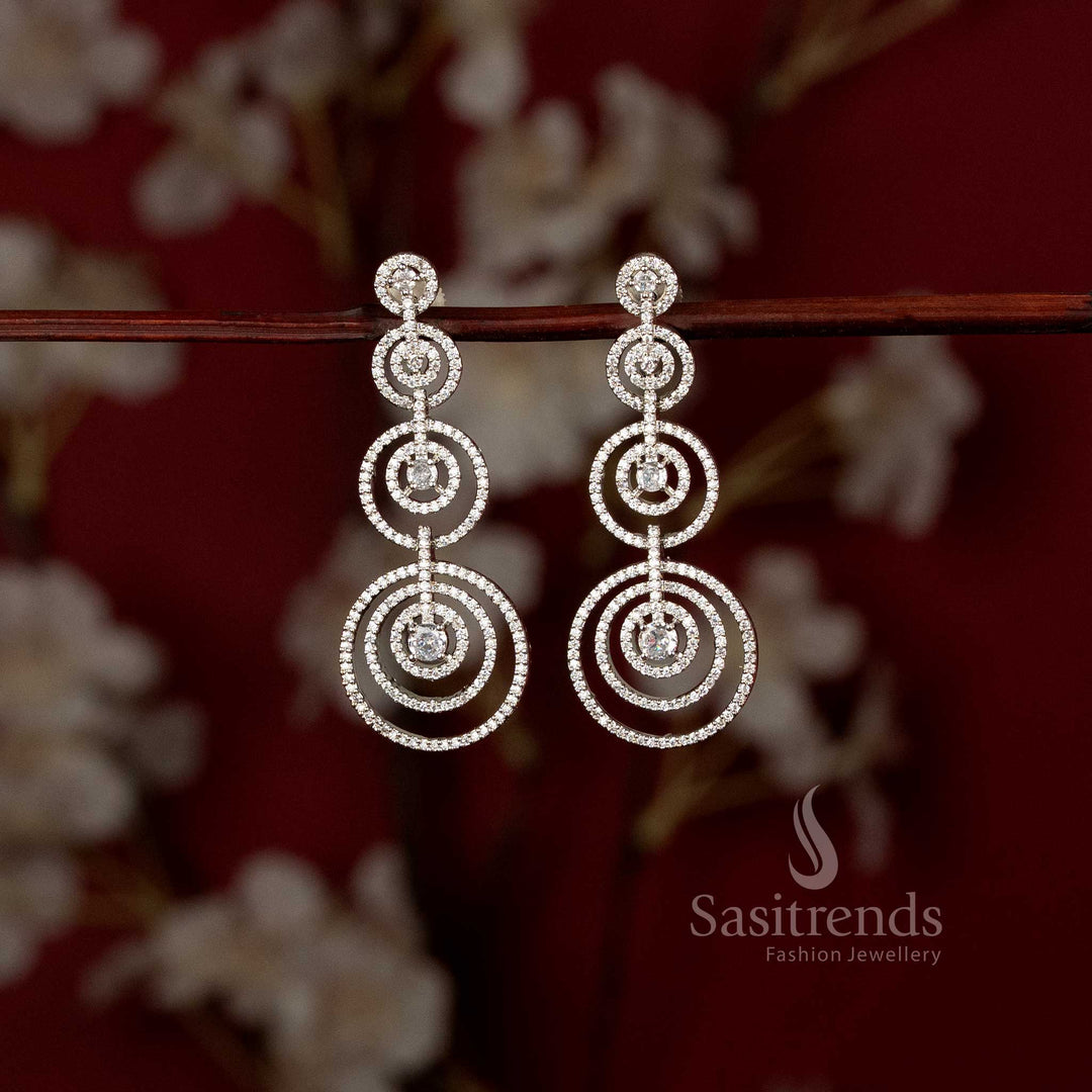 Captivating rhodium silver plated concentric circles dangler earrings adorned with American Diamond stones – Modern elegance partywear jewellery for stylish women – Sasitrends