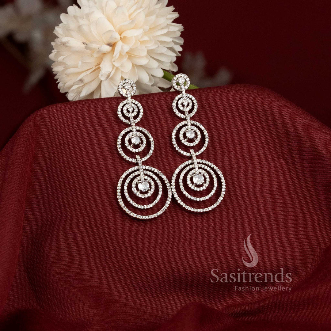 Captivating rhodium silver plated concentric circles dangler earrings adorned with American Diamond stones – Modern elegance partywear jewellery for stylish women – Sasitrends