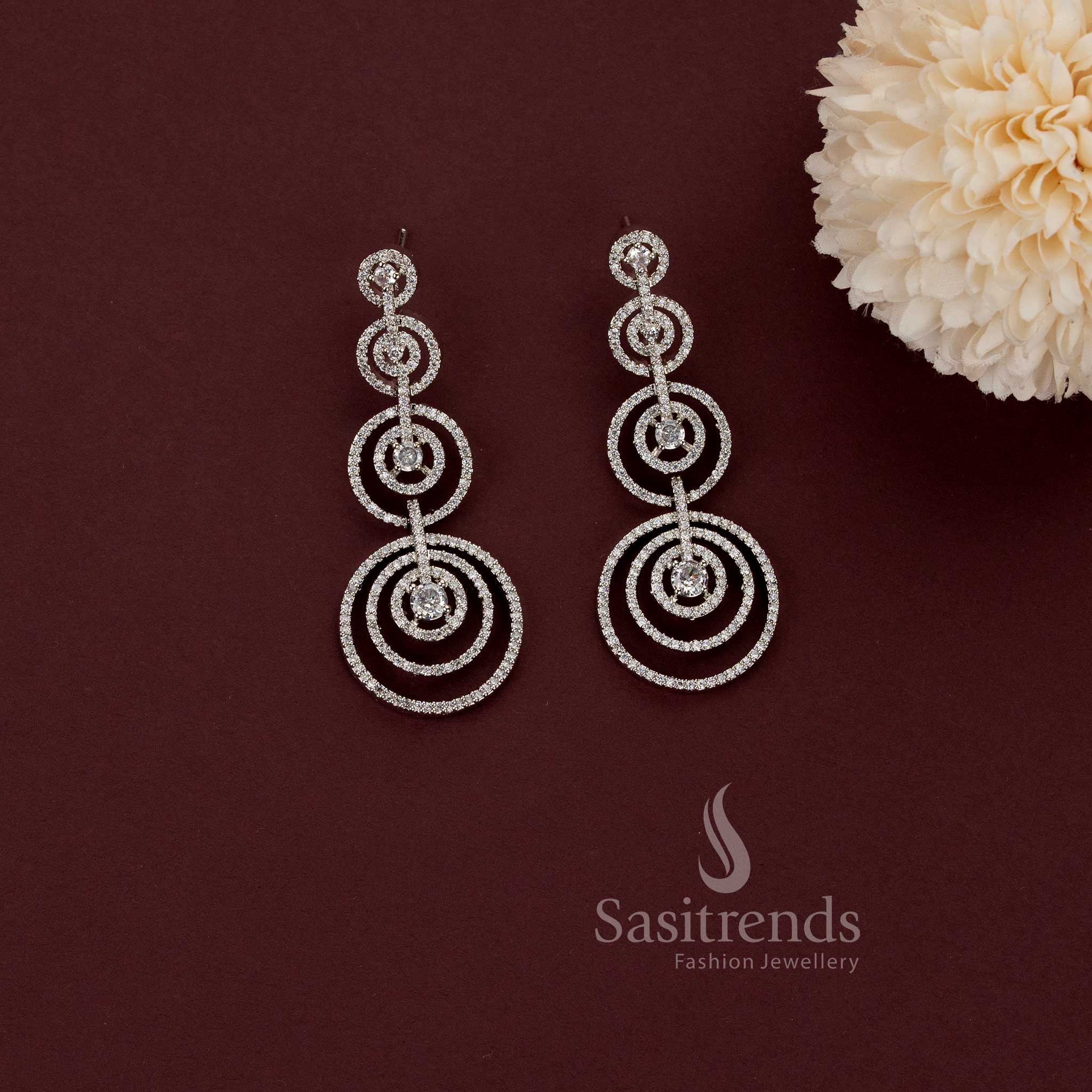 Captivating rhodium silver plated concentric circles dangler earrings adorned with American Diamond stones – Modern elegance partywear jewellery for stylish women – Sasitrends