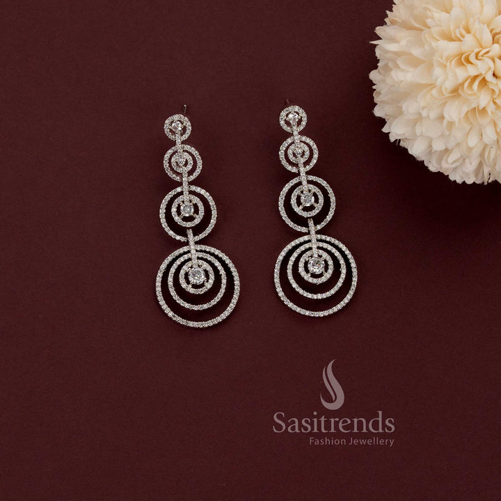 Captivating rhodium silver plated concentric circles dangler earrings adorned with American Diamond stones – Modern elegance partywear jewellery for stylish women – Sasitrends
