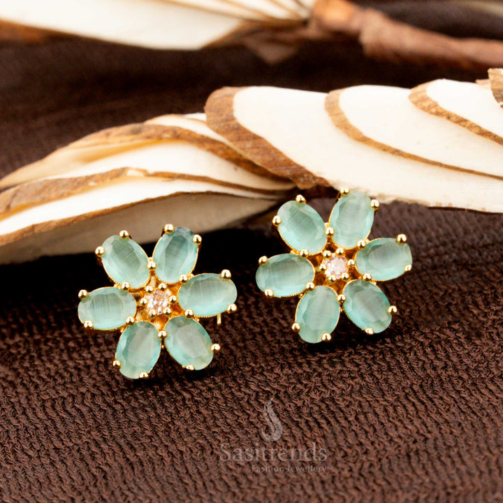 Charming gold-plated floral stud earrings adorned with mint American diamond stones, a beautiful addition to traditional attire, sarees, and grand ethnic celebrations - Sasitrends
