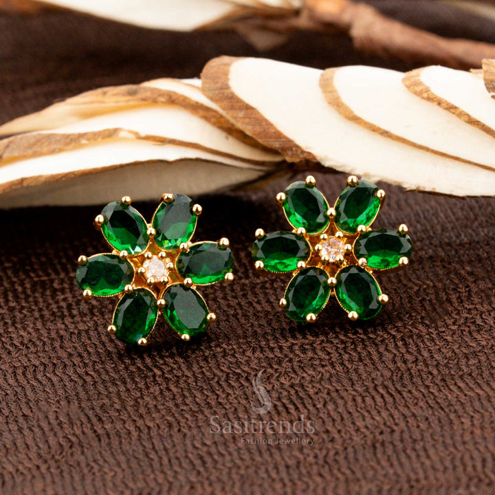 Handcrafted gold-plated floral stud earrings featuring brilliant green American diamond stones, an elegant accessory for bridal fashion, cultural events, and traditional sarees - Sasitrends