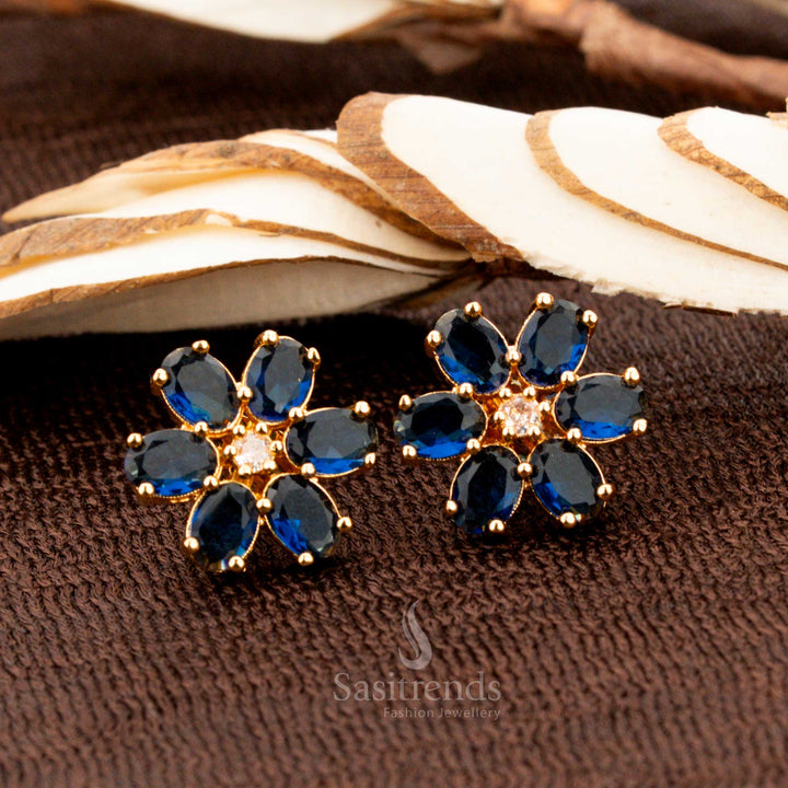 Glamorous gold-plated American diamond floral stud earrings with striking blue stones, a dazzling jewellery choice for luxurious bridal wear, grand occasions, and elegant fashion - Sasitrends