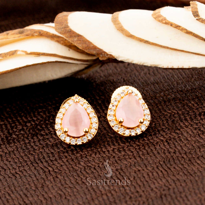Stylish gold-plated oval stud earrings featuring a delicately crafted pink American diamond stone setting, an ideal accessory for festivals, sarees, and elegant evening ensembles - Sasitrends