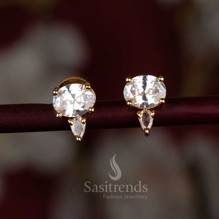 Elegant gold-plated white American Diamond stud earrings with a fusion of oval and pear-shaped stones – a classy party wear jewellery pick from Sasitrends