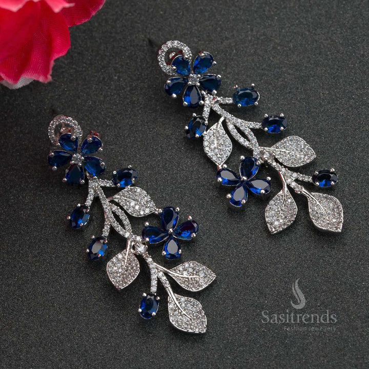 Deep blue flower-inspired rhodium earrings adorned with American Diamond stones – sparkling party jewellery for adding grace and charm – Sasitrends