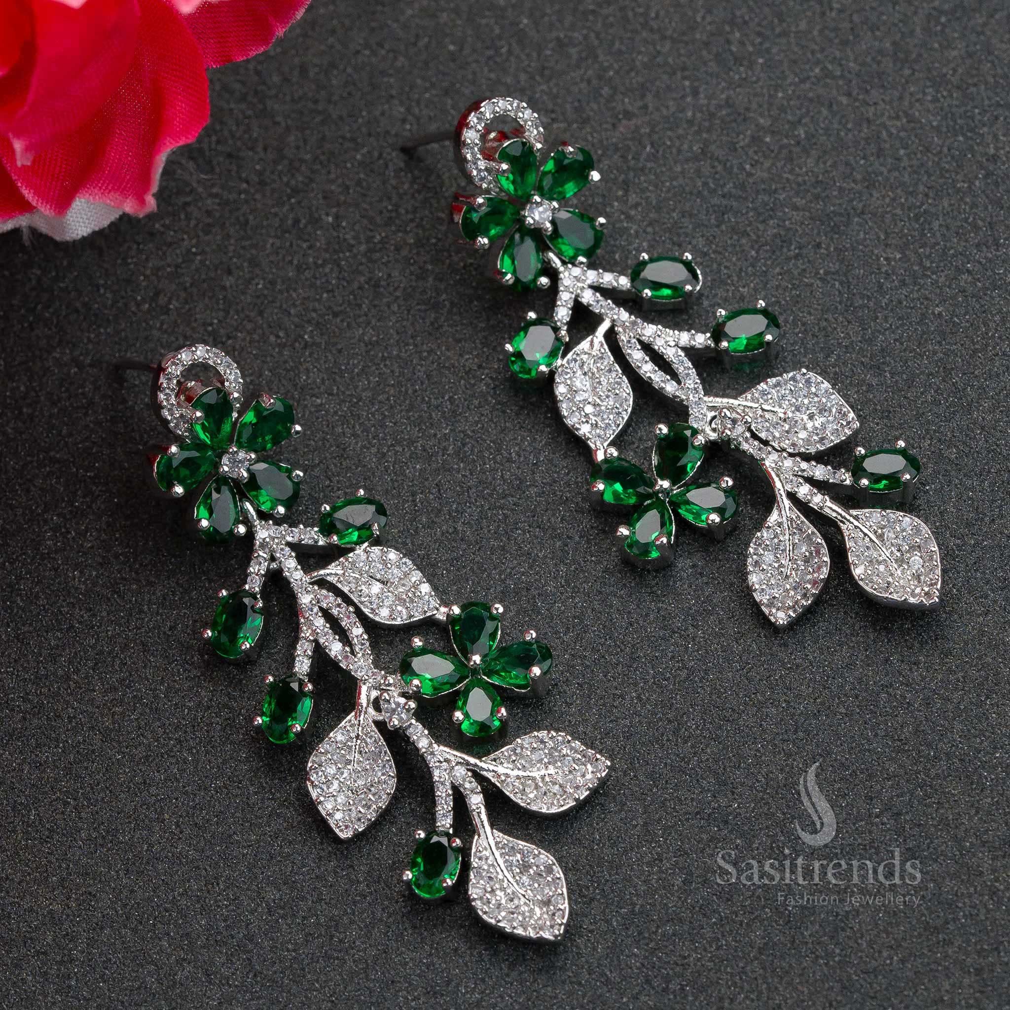 Radiant green flower-pattern rhodium plated earrings with shimmering AD stones – elegant party jewellery suited for every celebration – Sasitrends