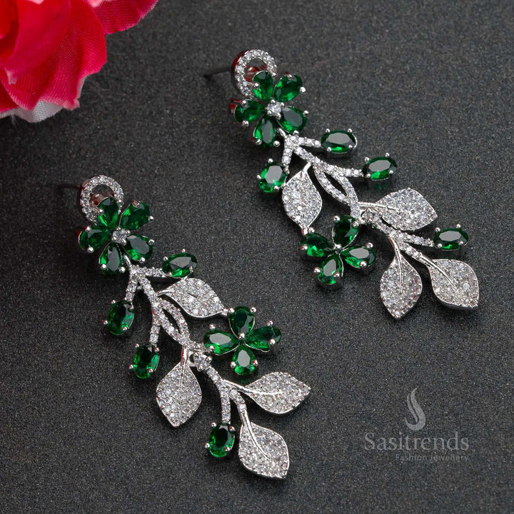 Radiant green flower-pattern rhodium plated earrings with shimmering AD stones – elegant party jewellery suited for every celebration – Sasitrends