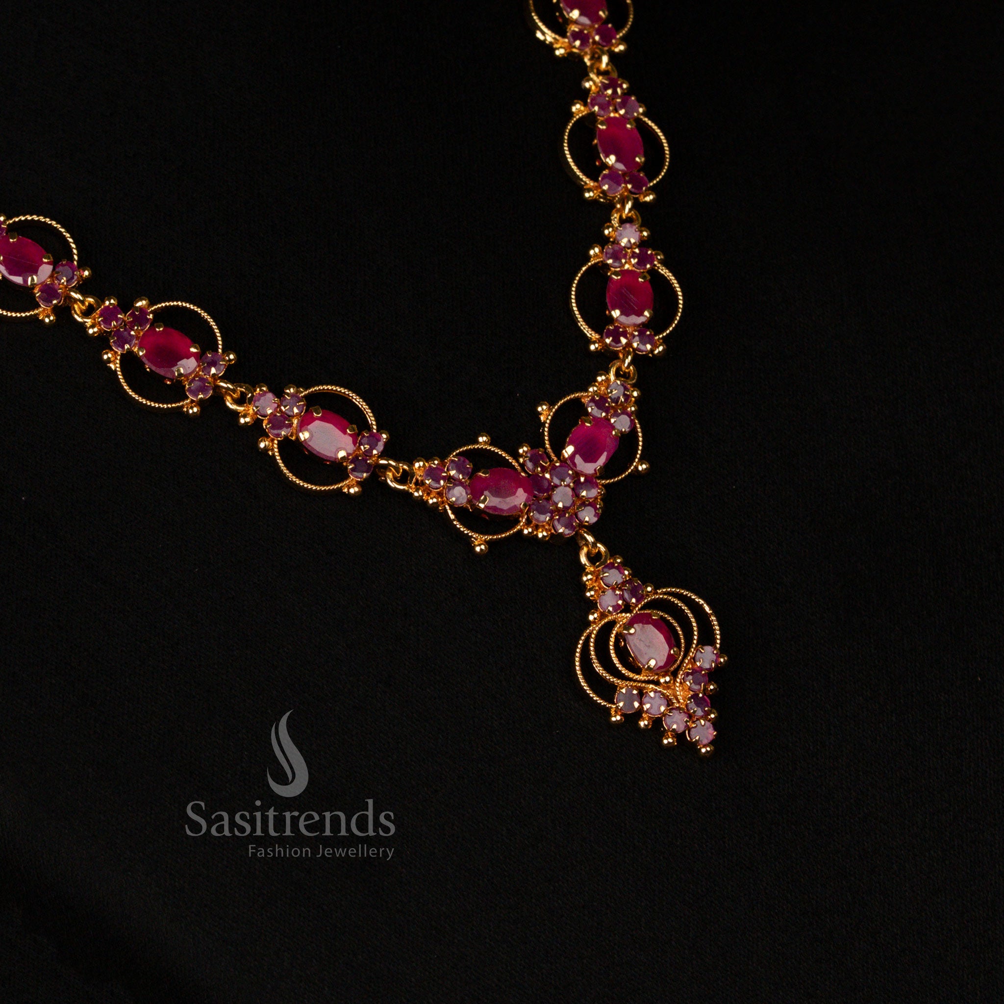 Designer micro gold-plated necklace with exquisite ruby stones and shimmering American diamond embellishments, a trendy jewellery masterpiece for women’s fashion - Sasitrends
