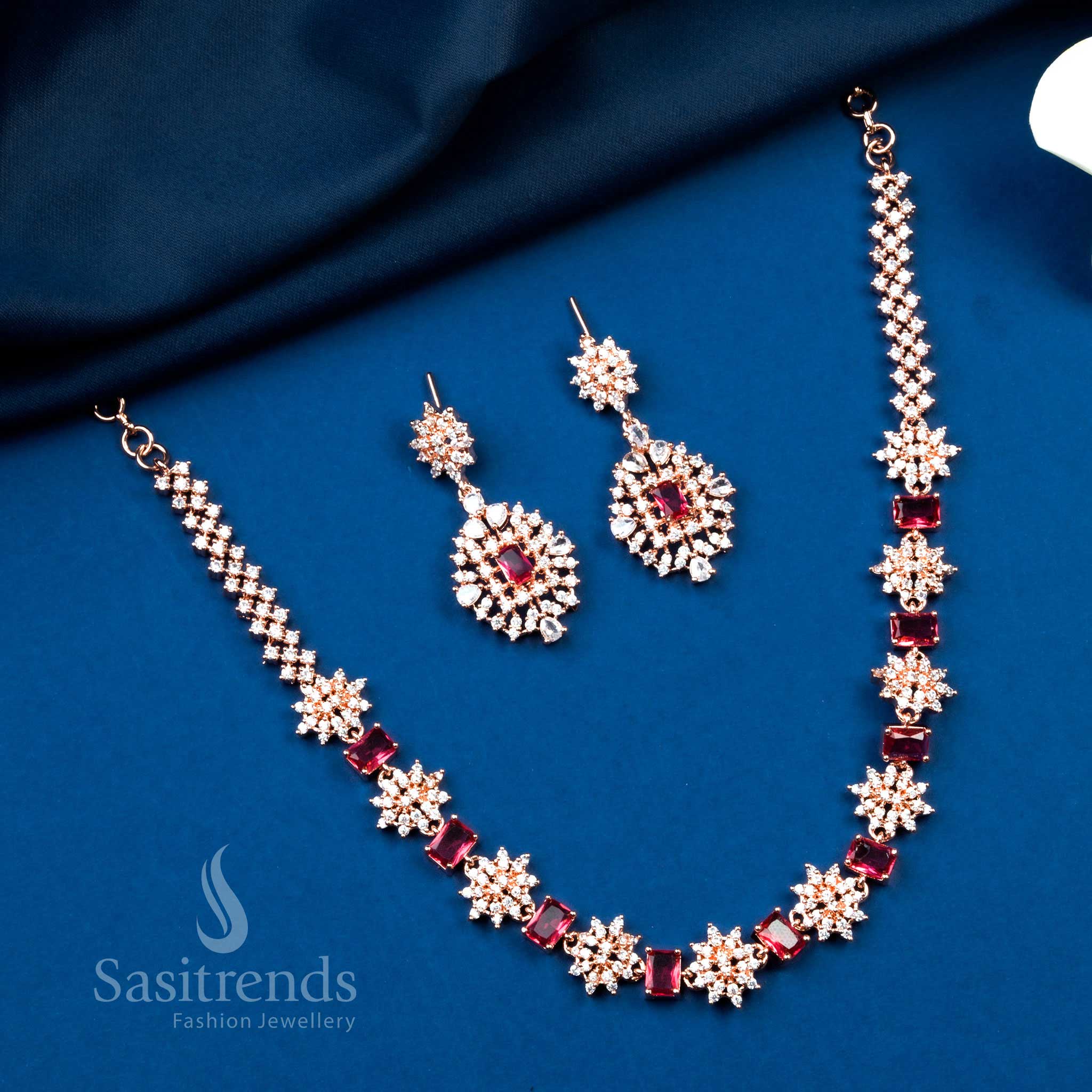 Classic red party wear jewellery set in rose gold finish, detailed with floral sparkle and regal vibes – Sasitrends