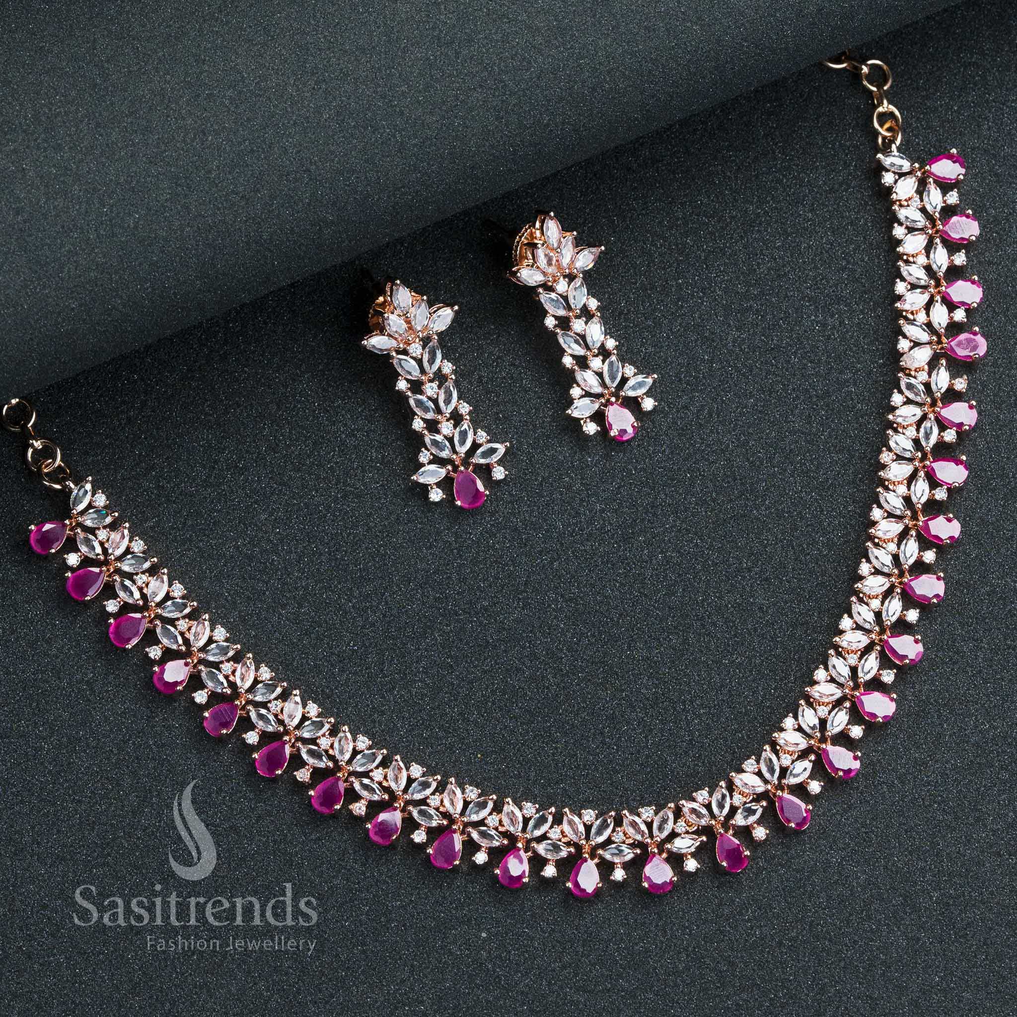 Deep ruby rose gold plated party wear jewellery set featuring blooming floral design and dazzling American diamonds – Sasitrends

