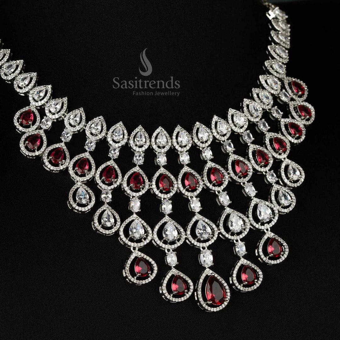 Luxurious red bridal jewellery ensemble in rhodium plating, embellished with dazzling American diamonds for grand bridal occasions - Sasitrends