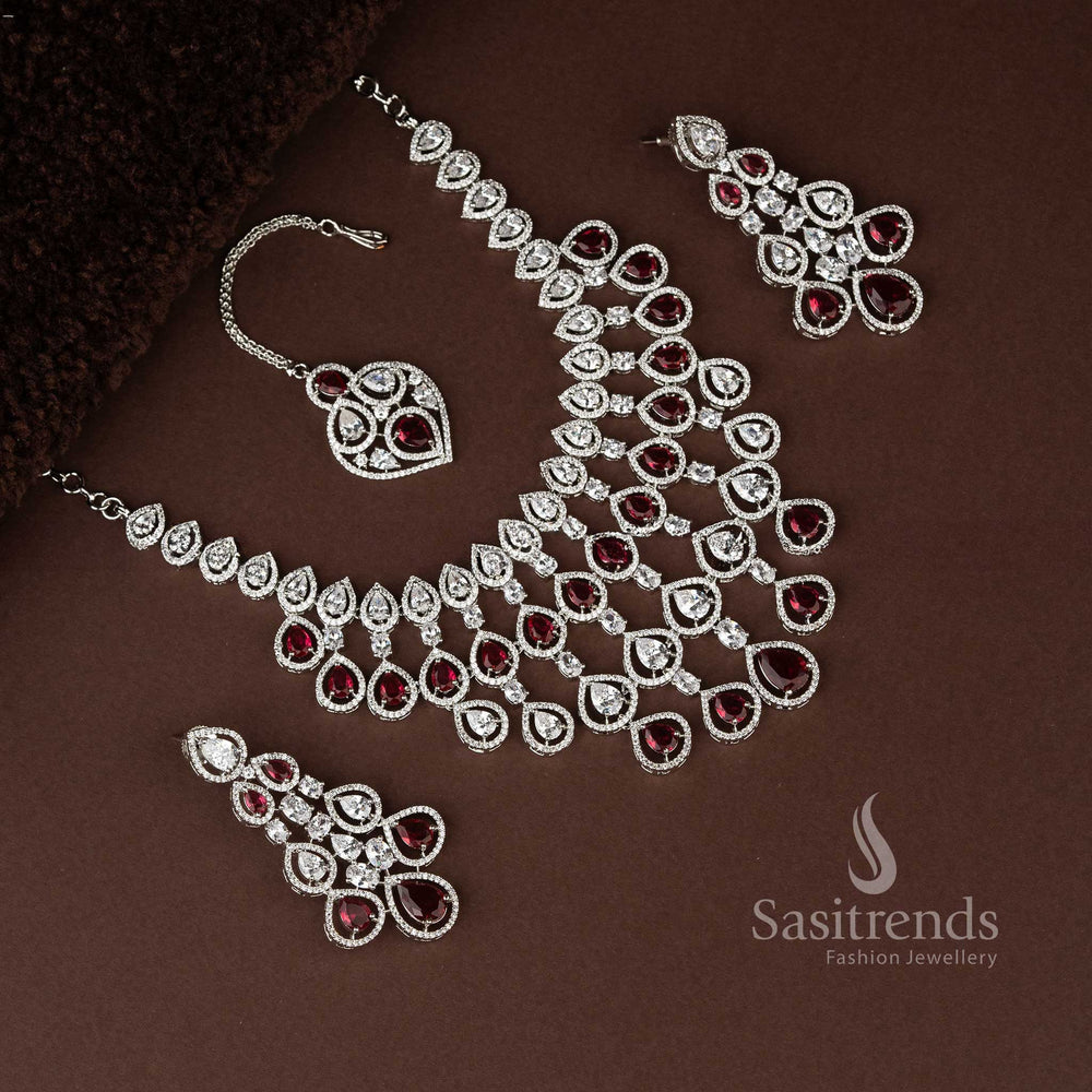 Luxurious red bridal jewellery ensemble in rhodium plating, embellished with dazzling American diamonds for grand bridal occasions - Sasitrends