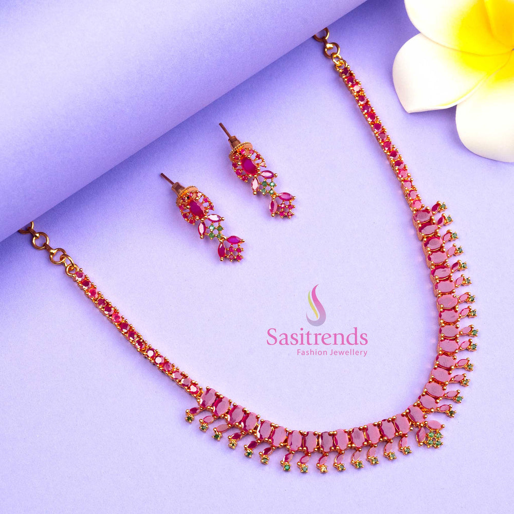 Gorgeous ruby and green micro gold plated jewellery set enhanced with American Diamond touches, a traditional festive style perfect for bridal and ethnic looks - Sasitrends