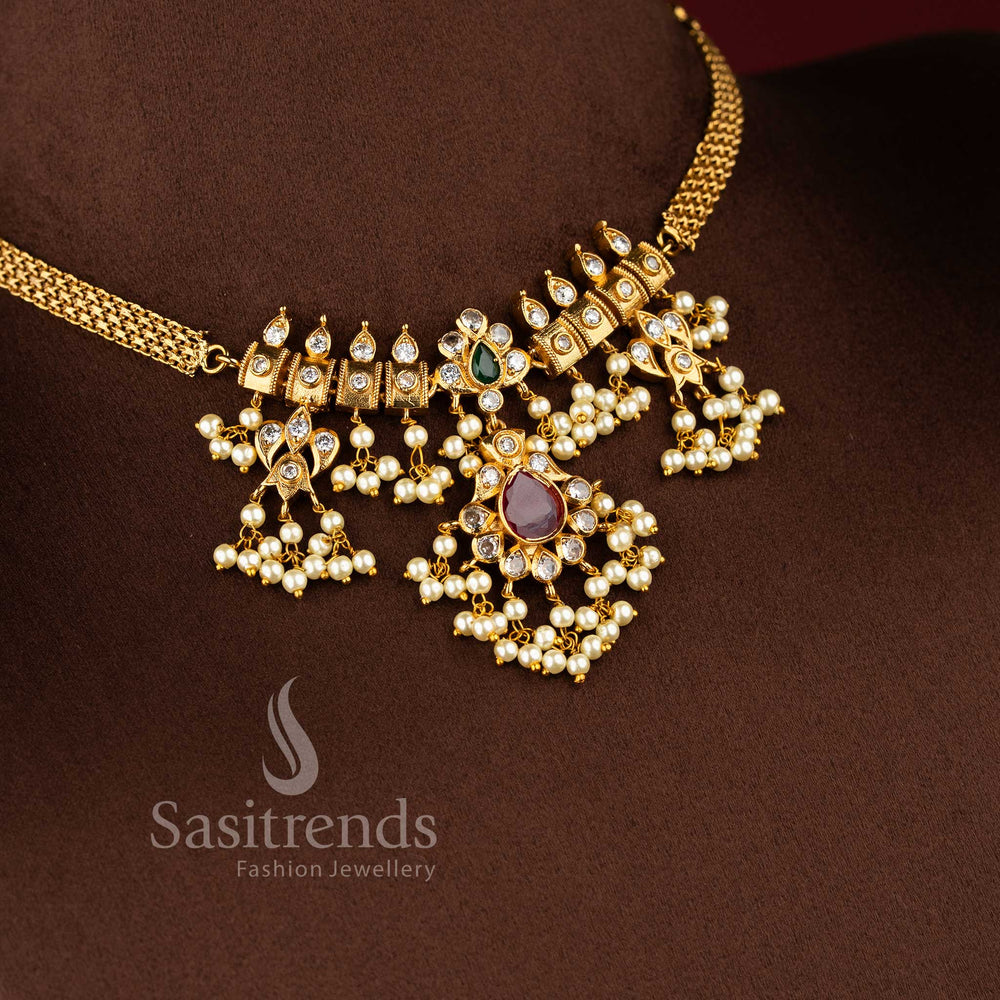 Temple matte gold plated guttapusalu choker necklace set with ruby pendant and pearl fringes by Sasitrends