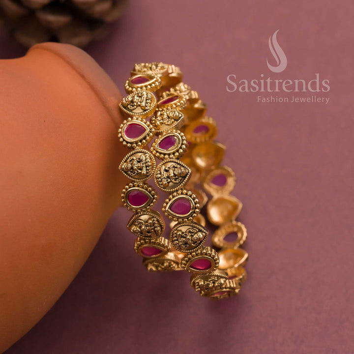 Traditional matte gold temple-style bangles with ruby red AD thilak motifs and Lakshmi carvings, perfect for wedding wear and regal South Indian jewellery appeal – sasitrends