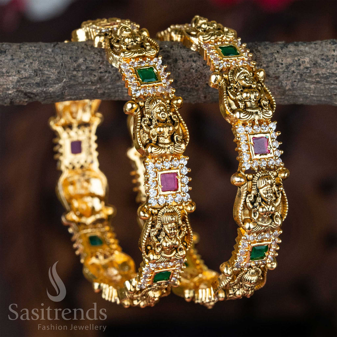 Divine Lakshmi temple bangle set with matte gold plating and colourful kemp stone inlay, radiating South Indian bridal grandeur and sacred craftsmanship – traditional wedding jewellery by Sasitrends