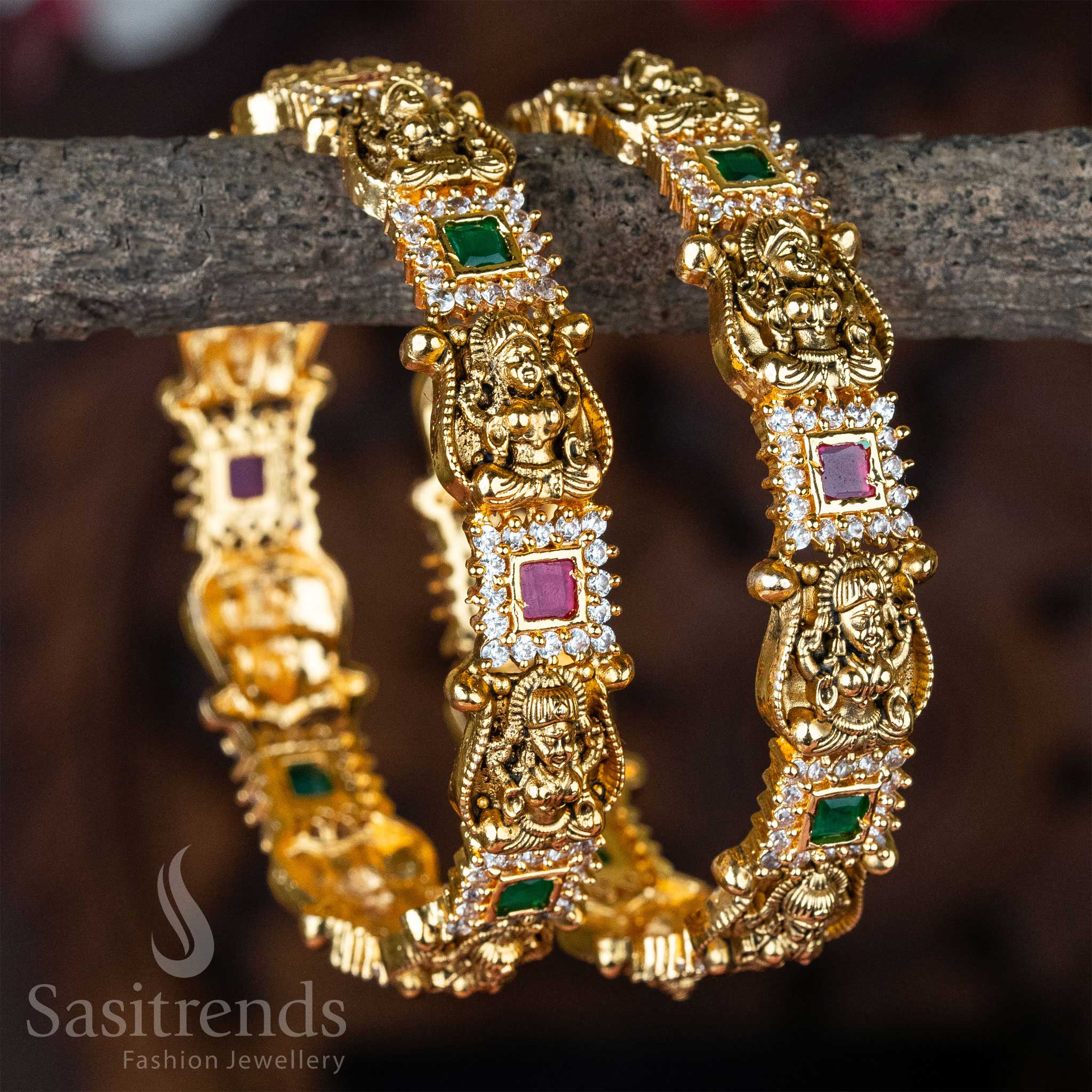 Divine Lakshmi temple bangle set with matte gold plating and colourful kemp stone inlay, radiating South Indian bridal grandeur and sacred craftsmanship – traditional wedding jewellery by Sasitrends
