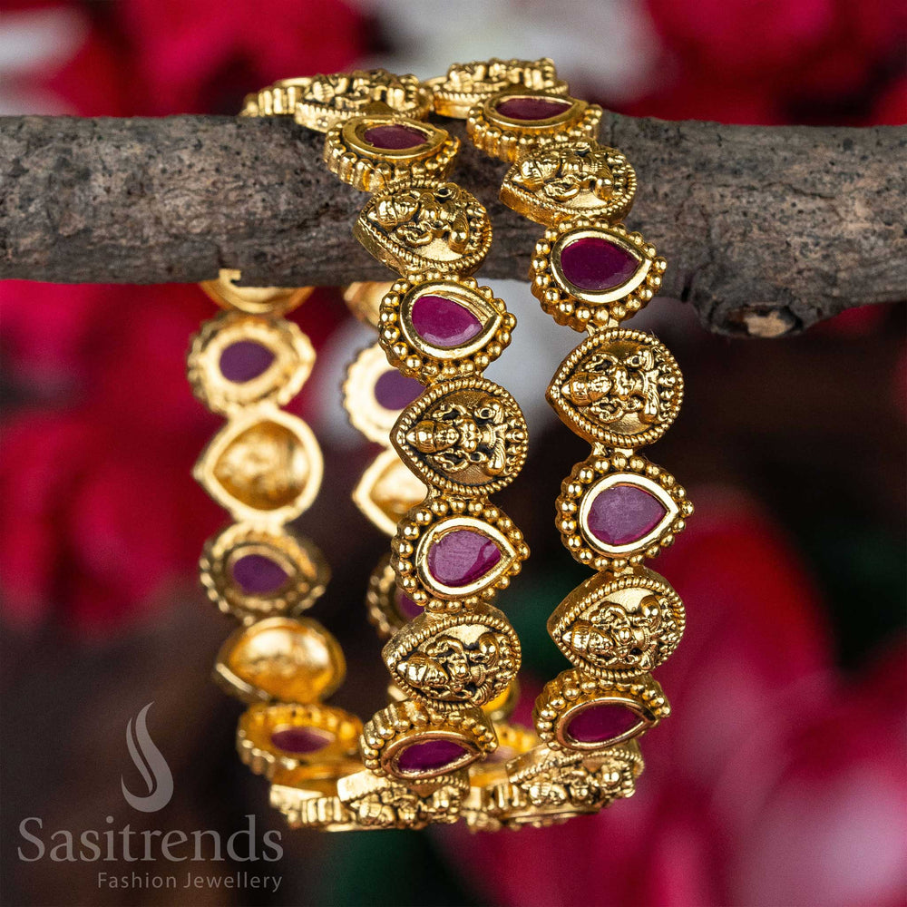 Temple matte gold plated bangles with divine Lakshmi motifs and ruby thilak-shaped AD stones, designed for bridal jewellery glamour and traditional ethnic finesse – sasitrends