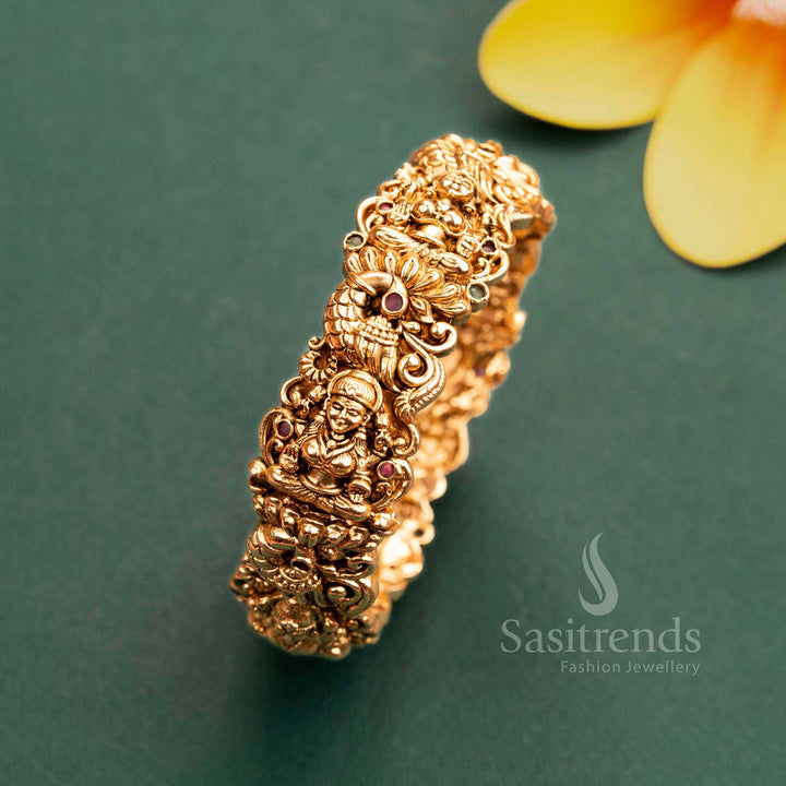 Matte Gold Lakshmi Peacock Kada Bangle with Ruby-Green Stones for Women