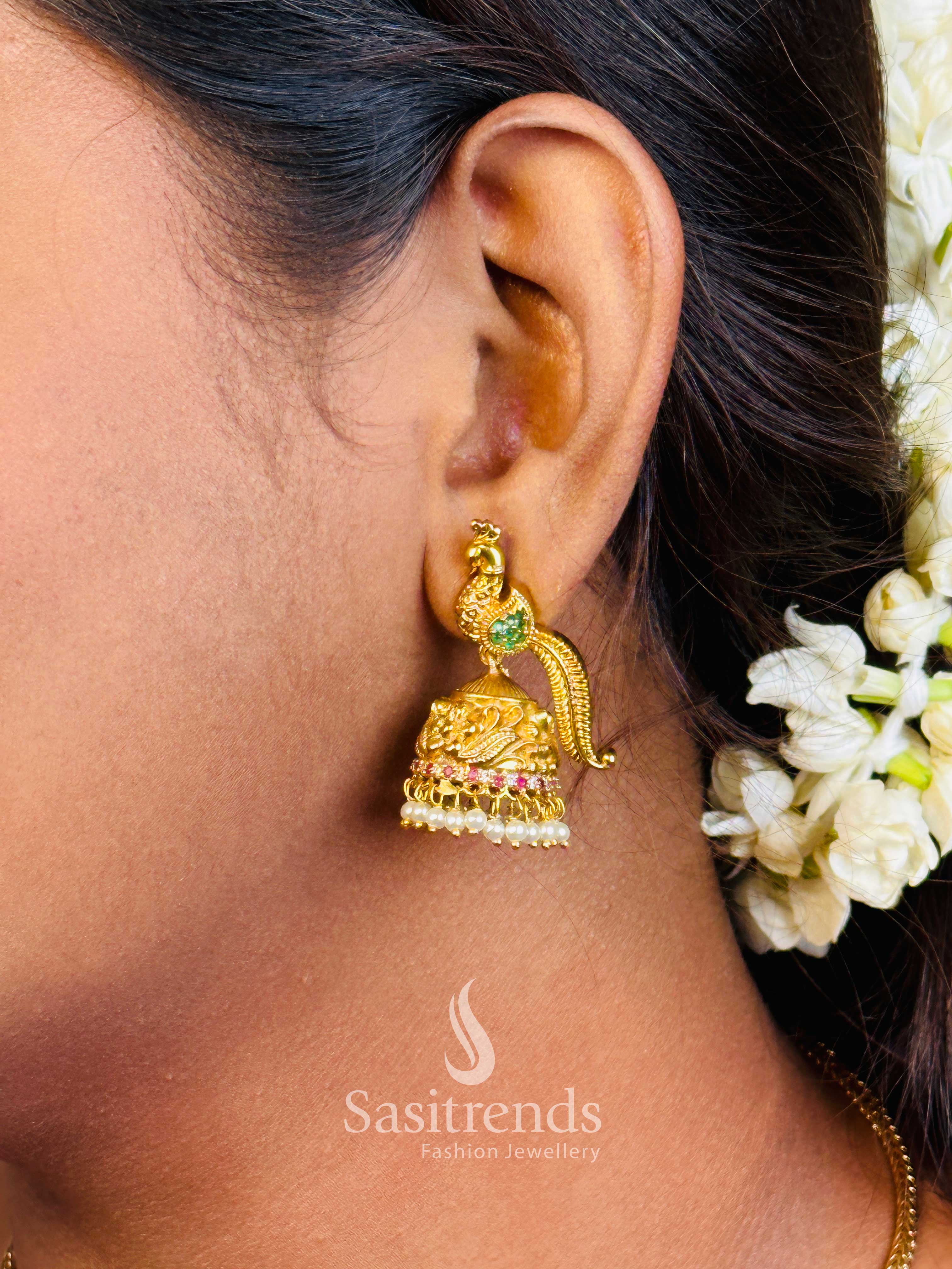 Classic multi temple jhumka earrings with brass base, peacock feather carvings, and delicate pearl drops for a royal traditional finish – Sasitrends