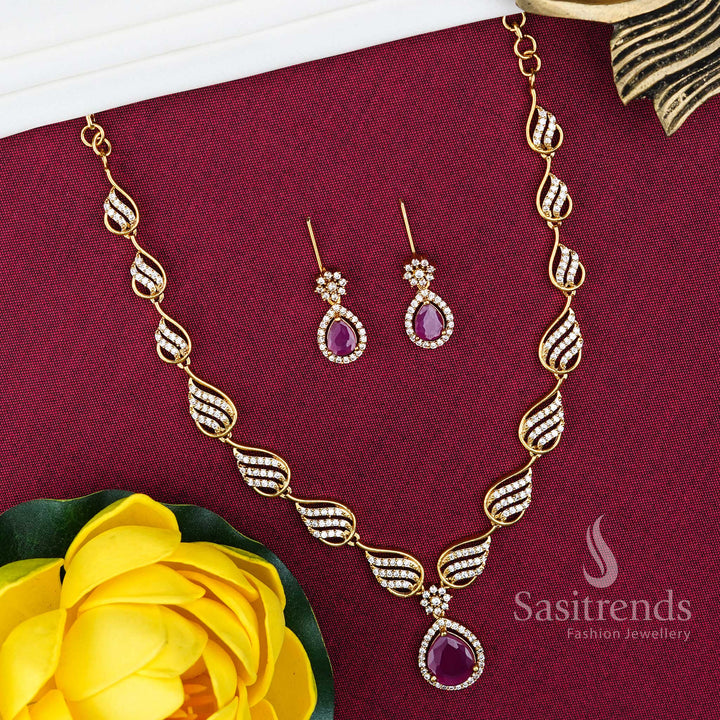 Elegant matte gold plated party wear jewellery set featuring a refined leaf motif with water drop pendant, accented by American diamond finish for a graceful evening look – Sasitrends