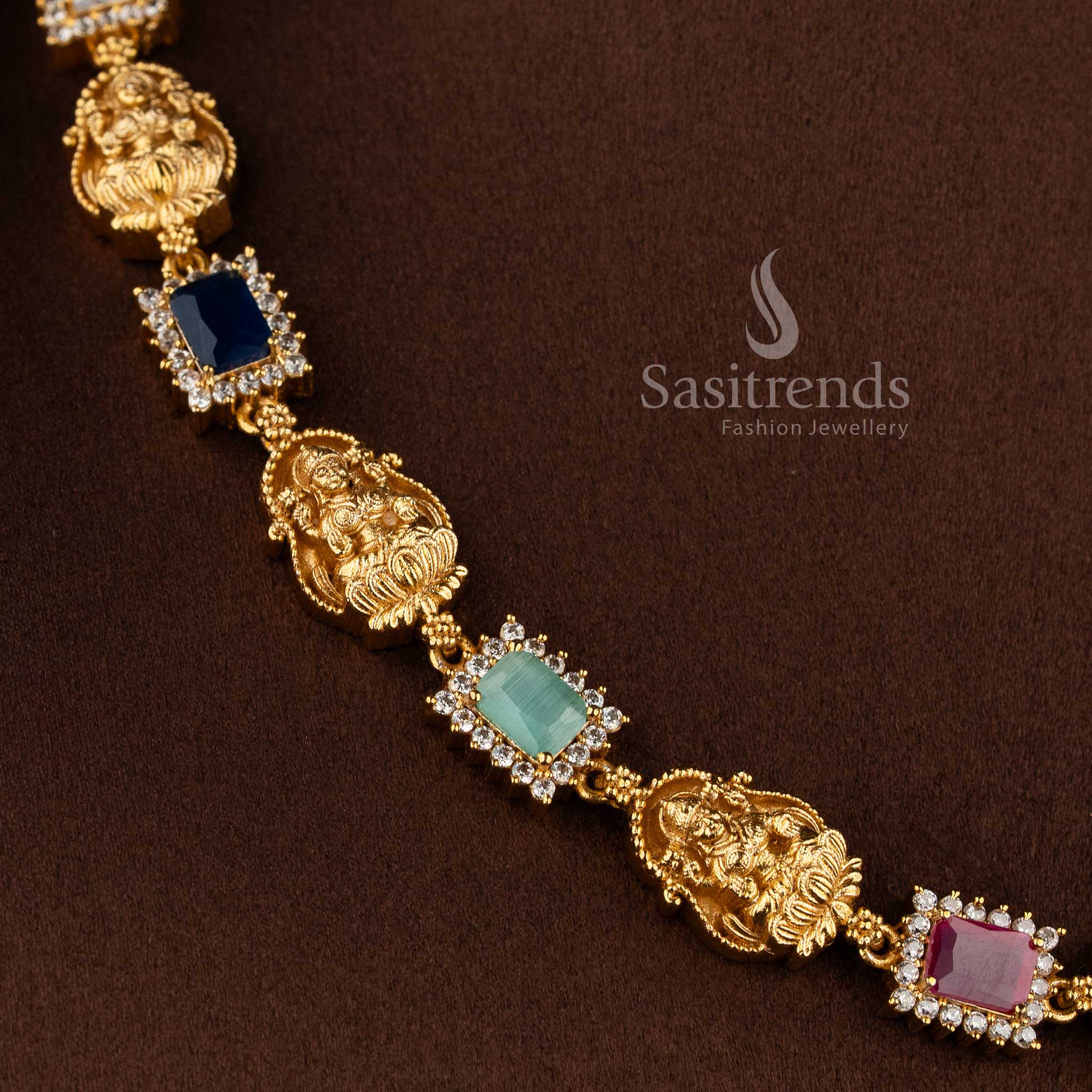 Matte gold temple necklace with Lakshmi motifs and multi-colored gemstones - Sasitrends