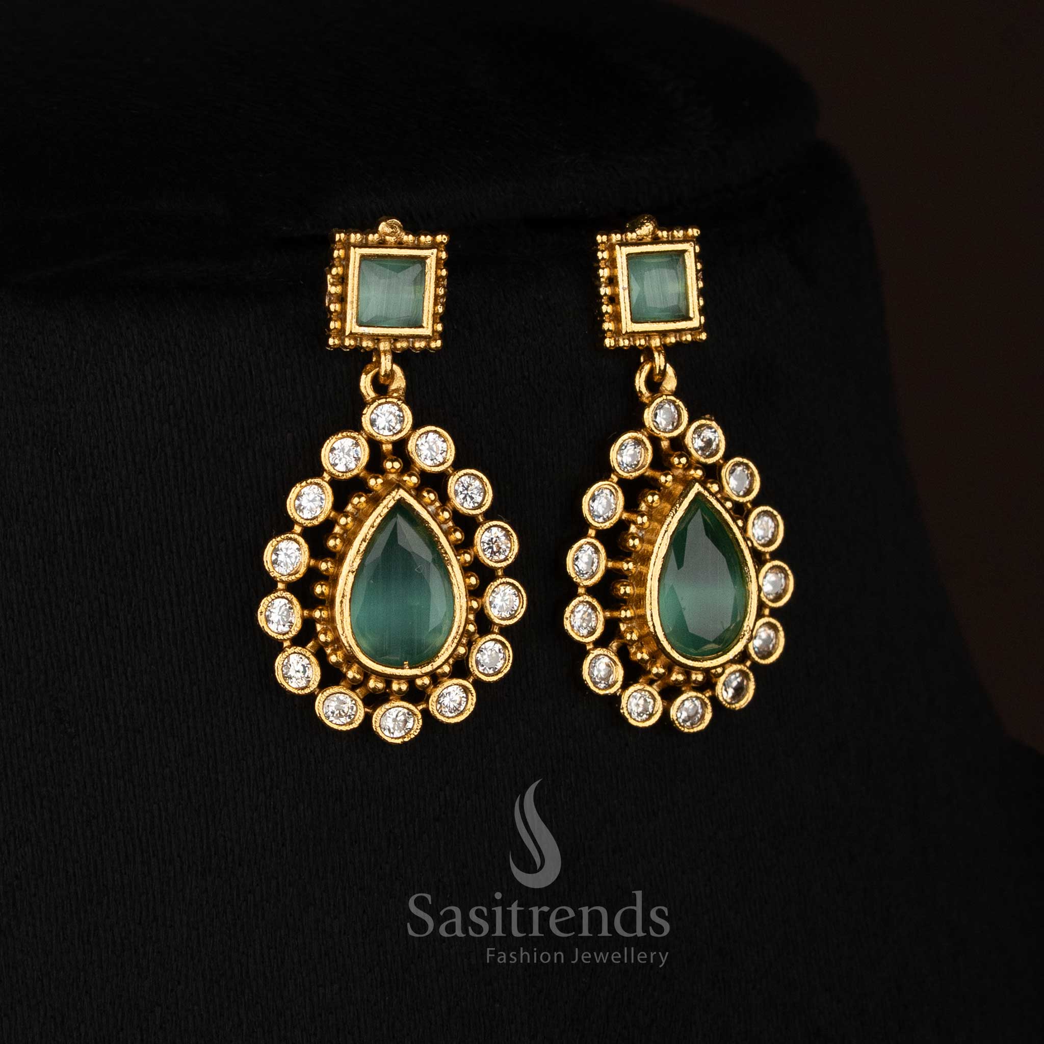 Graceful mint American Diamond matte gold plated teardrop stone earrings perfect for festive styling - Sasitrends