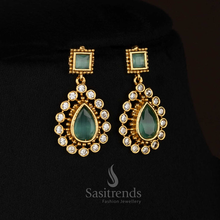 Graceful mint American Diamond matte gold plated teardrop stone earrings perfect for festive styling - Sasitrends