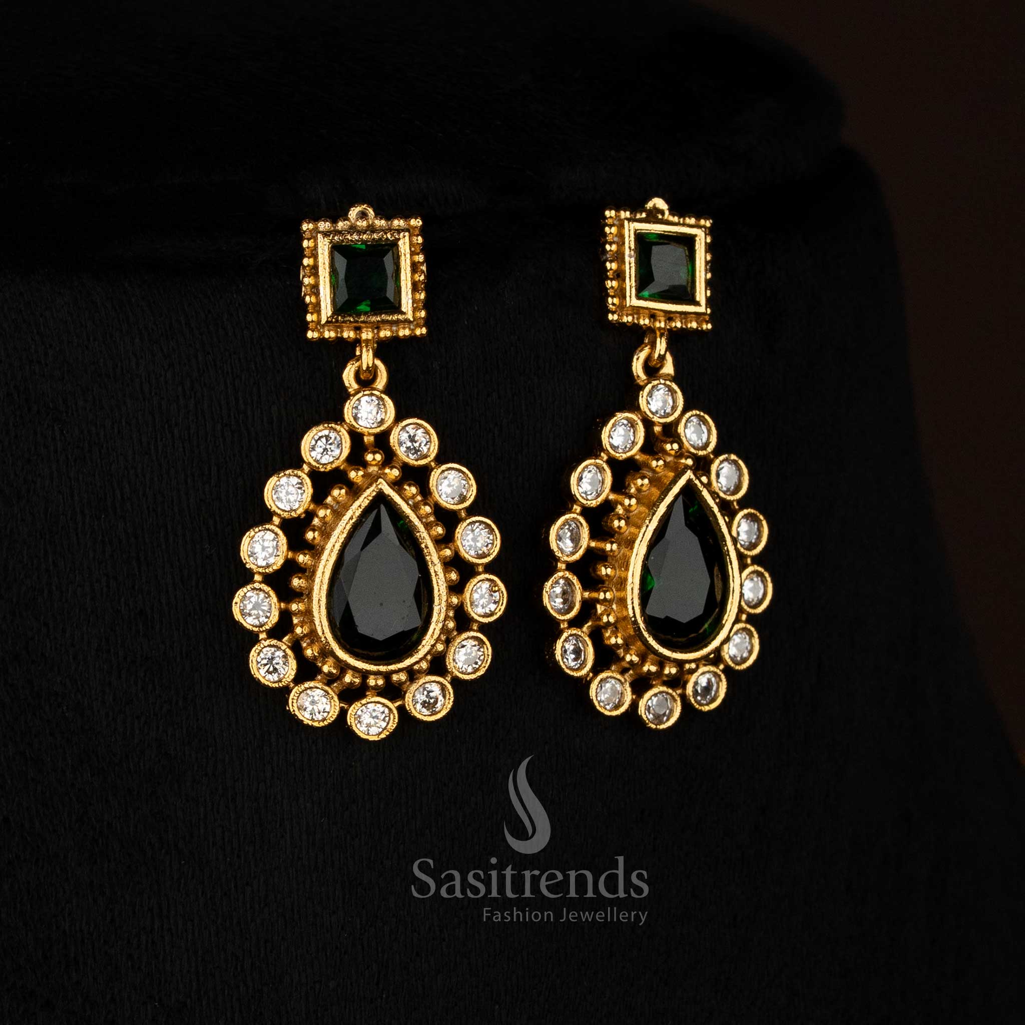 Elegant green American Diamond matte gold plated teardrop stone earrings suitable for festive celebrations - Sasitrends