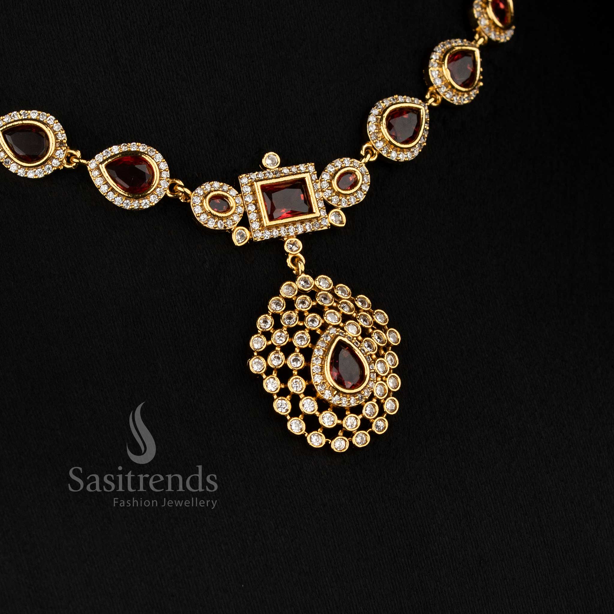 Regal red American Diamond matte gold plated teardrop rectangle motif necklace for stylish functions - Sasitrends