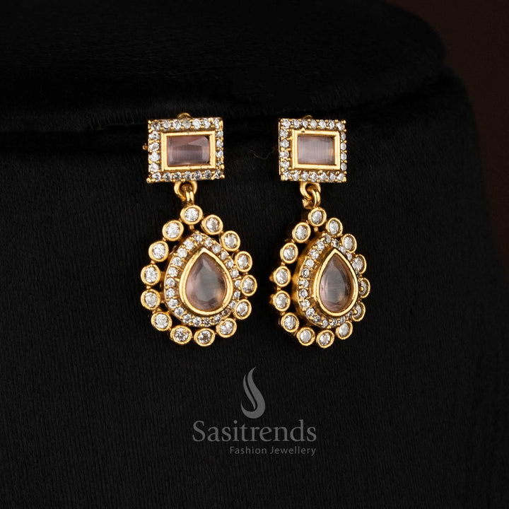 Graceful pink American Diamond matte gold plated teardrop rectangle motif earrings for stylish gatherings - Sasitrends