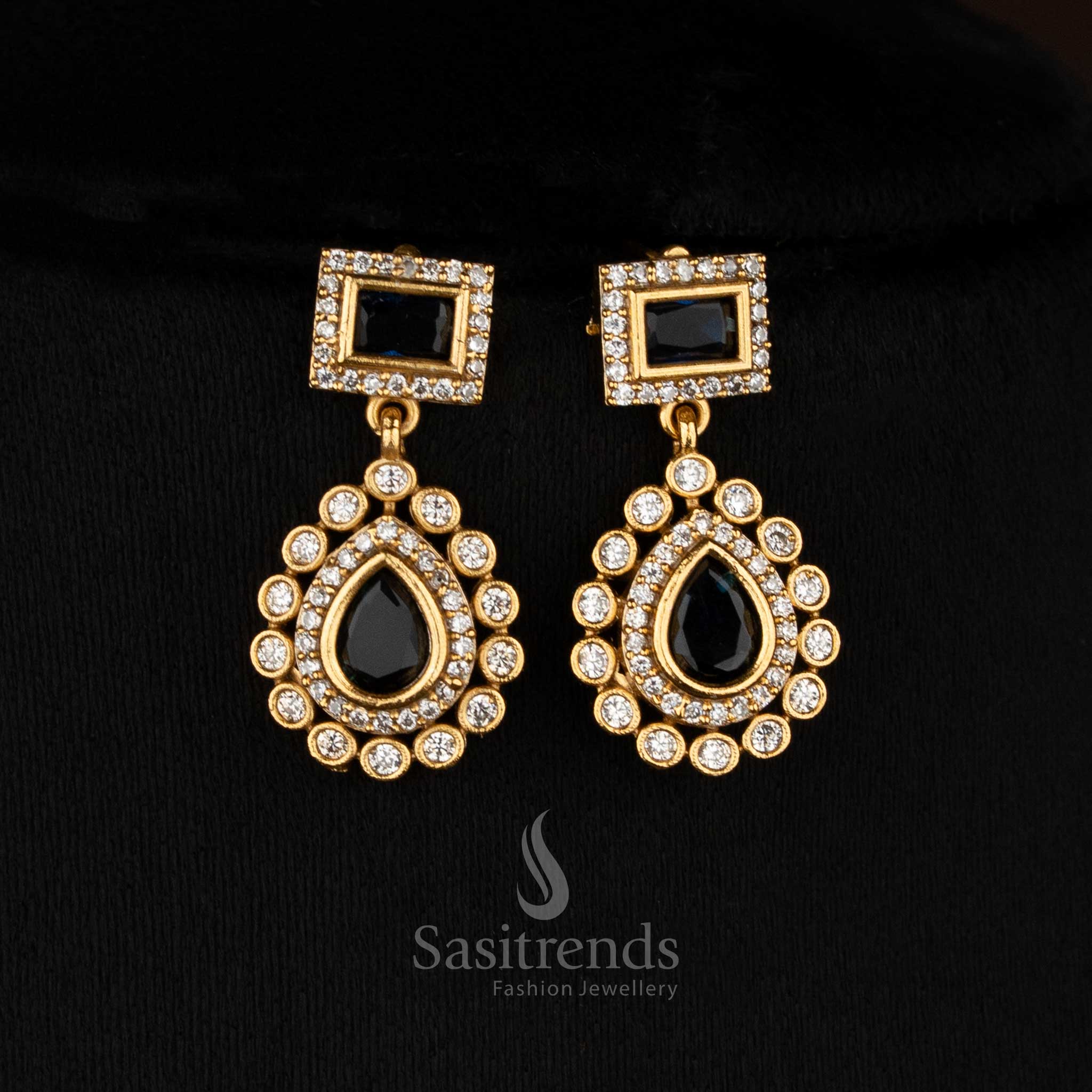 Sleek black American Diamond teardrop rectangle motif matte gold plated earrings for modern functions - Sasitrends