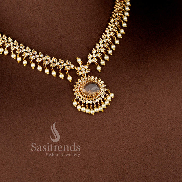 Close-up view of Matte Gold Plated American Diamond Oval Linked Necklace Set featuring cascading paisley motifs, pearl drops stones - Sasitrends