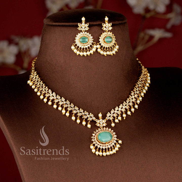 Close-up view of Matte Gold Plated American Diamond Oval Linked Necklace Set featuring cascading paisley motifs, pearl drops stones - Sasitrends