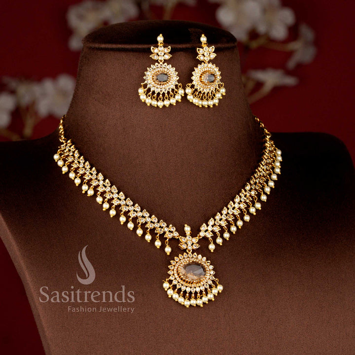 Close-up view of Matte Gold Plated American Diamond Oval Linked Necklace Set featuring cascading paisley motifs, pearl drops stones - Sasitrends