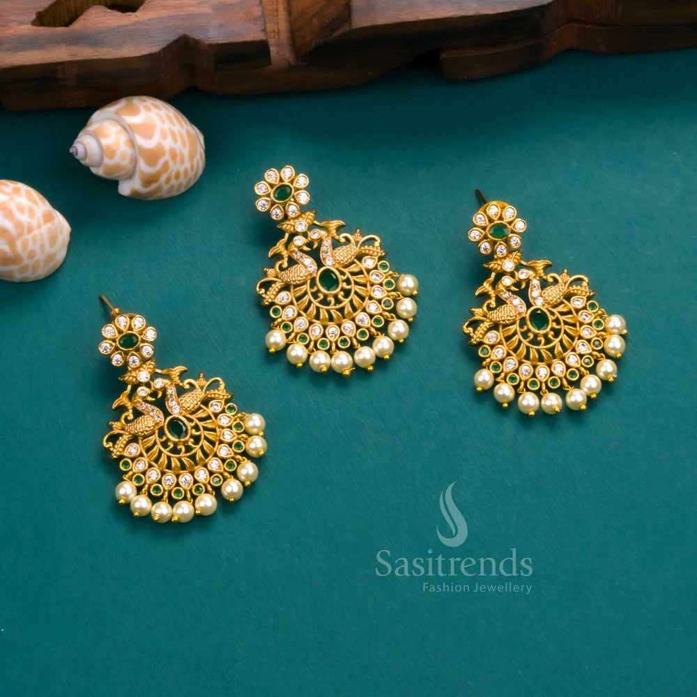 Traditional matte gold plated peacock pendant set enriched with white and green AD stones, highlighted with pearl accents and charming earrings – ideal for cultural functions by Sasitrends