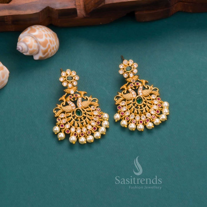 Vibrant matte finish temple-style in gold plating with multi-shade AD stones, adorned with pearl accents and festive earrings – a colourful statement piece from Sasitrends