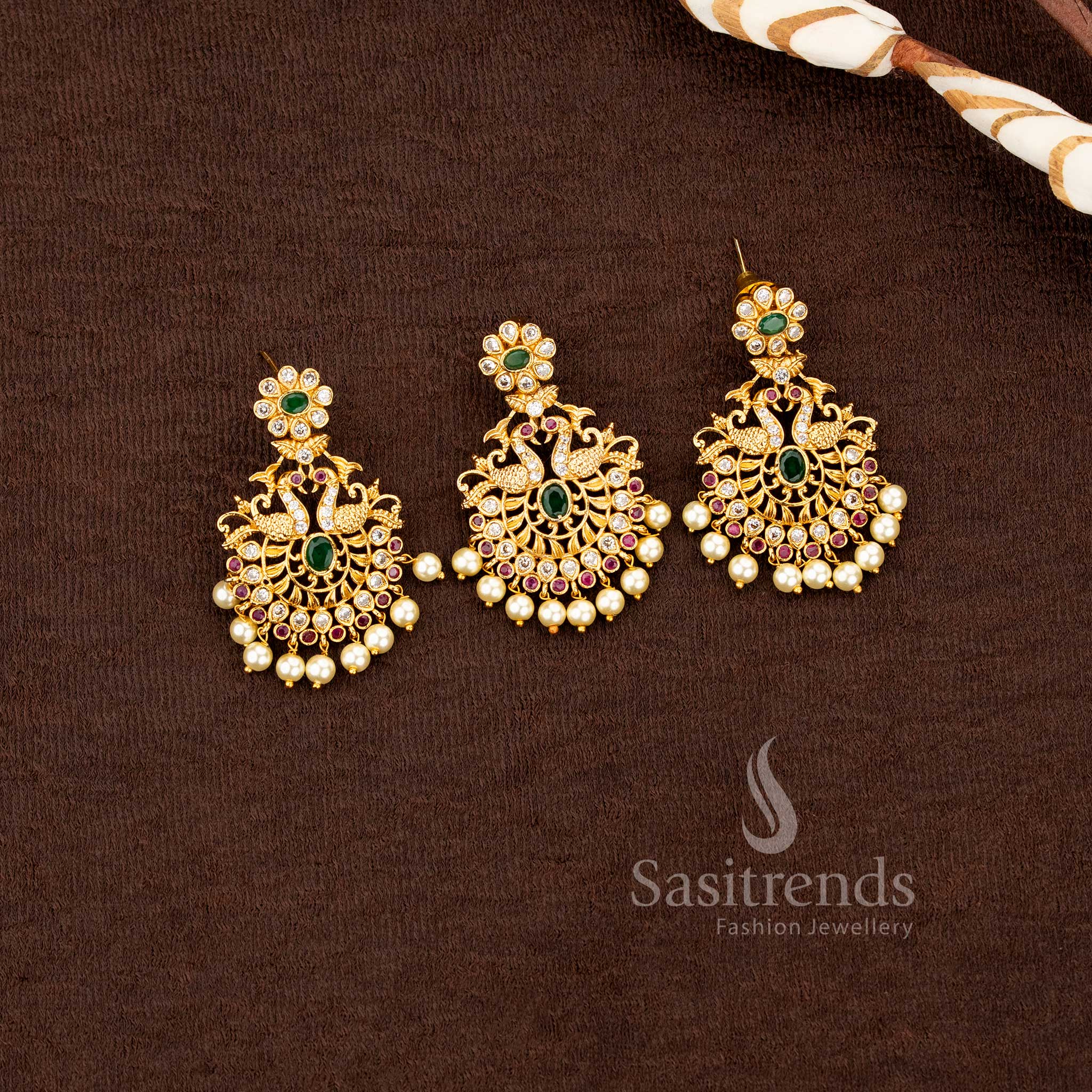 Elegant multi color jewellery set with peacock motif, American diamonds and pearl embellishments