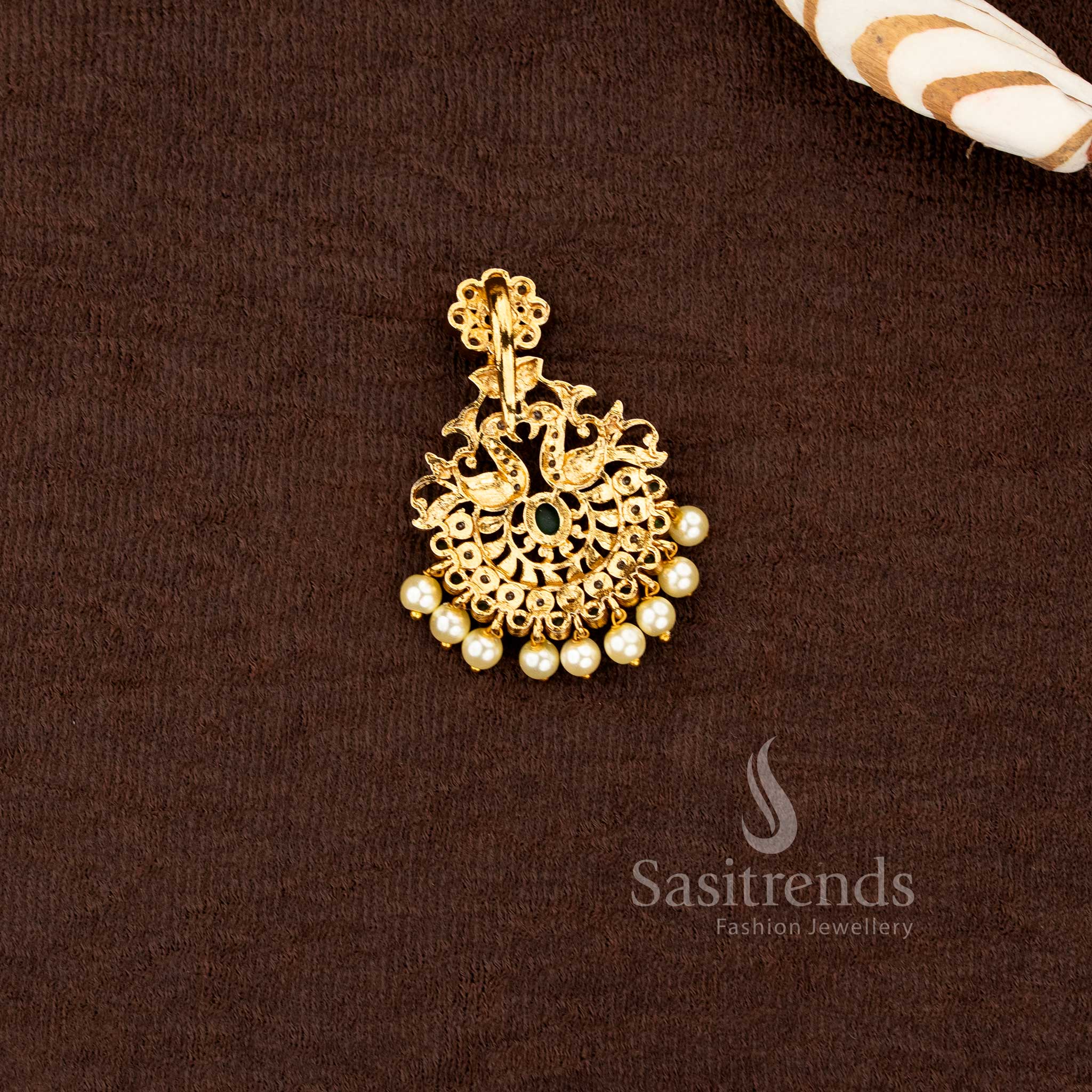 Matte gold plated multi color pendant set with American diamond stones, ruby green accents and pearl drops by Sasitrends