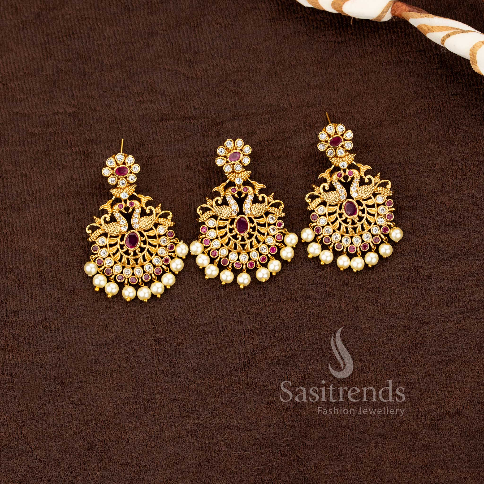South Indian matte gold pendant set with multi color stones and pearl clusters by Sasitrends